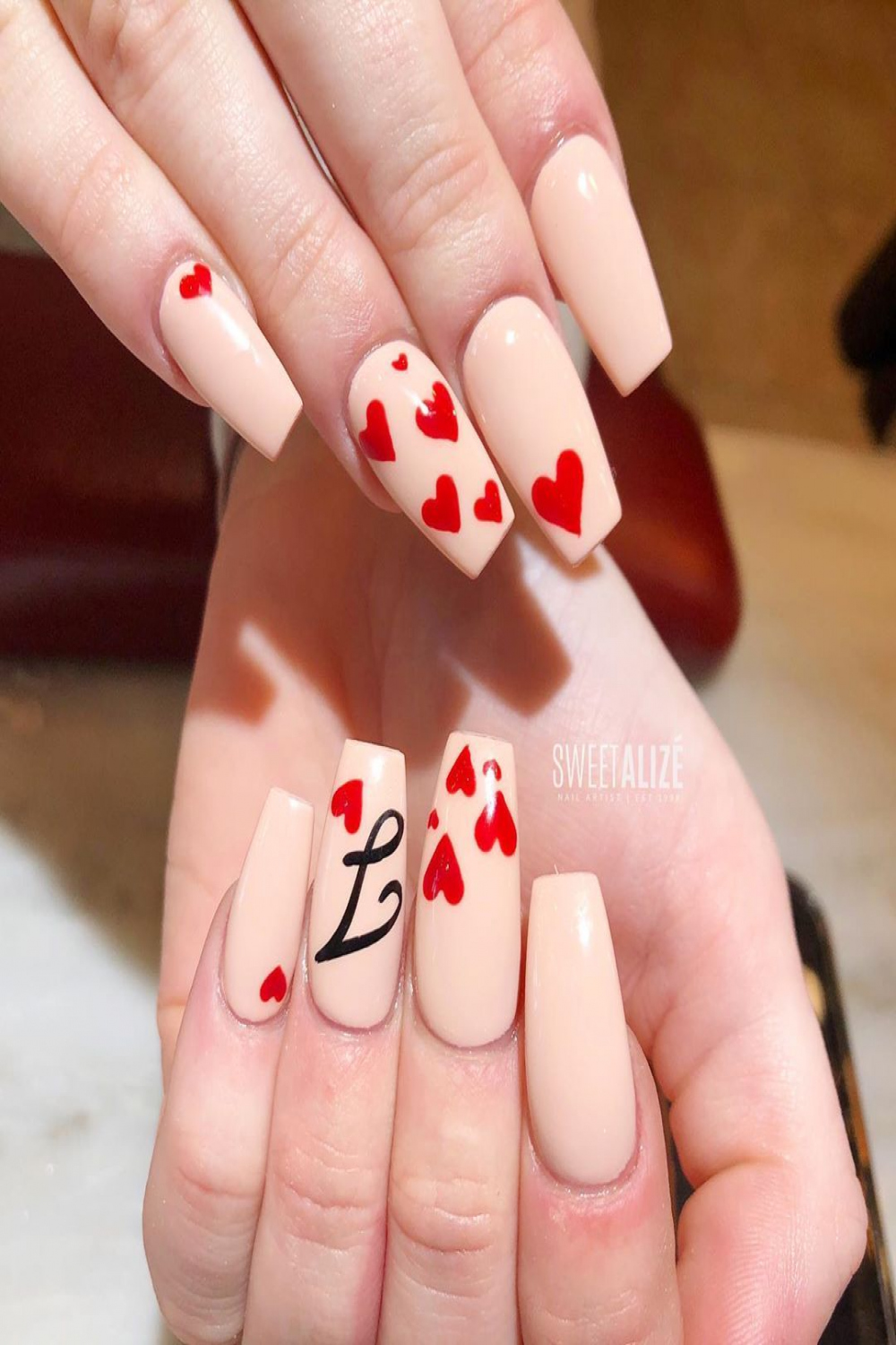 Acrylic, gel polish, hearts, and the cursive letter J for Tara