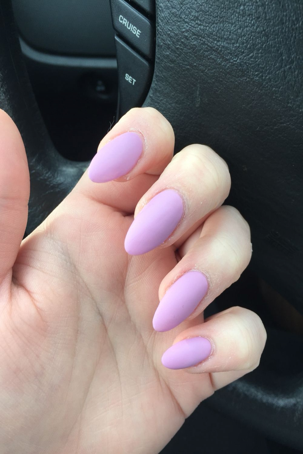 Almond shaped nails with a lavender OPI nail polish finished with