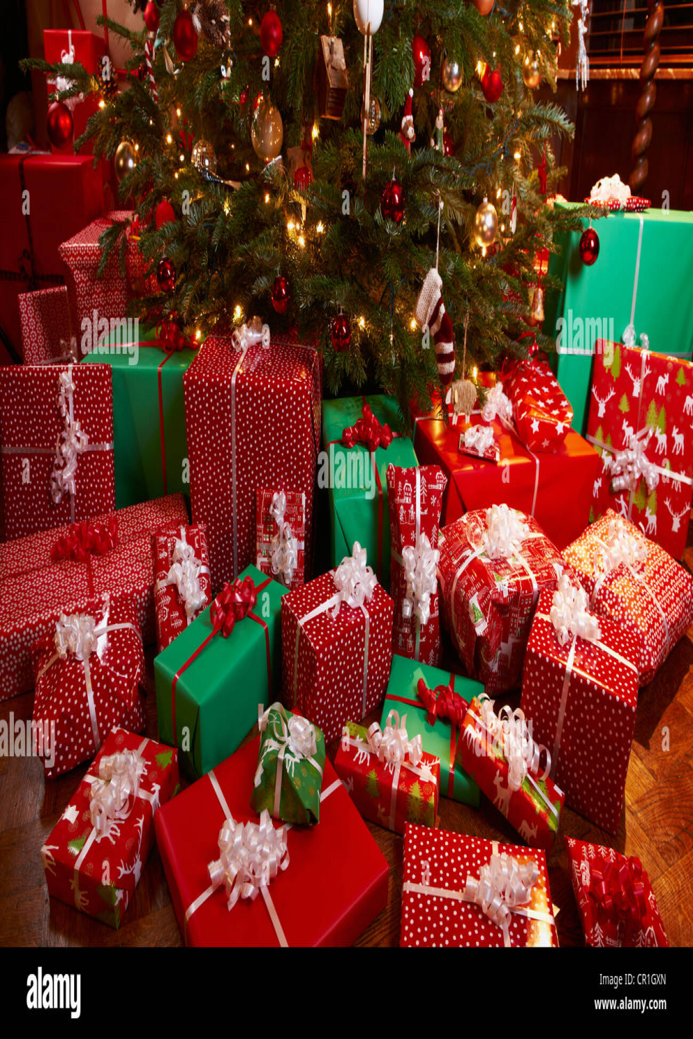 Christmas gifts under tree Stock Photo - Alamy