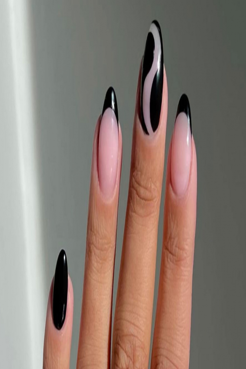 Gothic black French nails are trending as the emo alternative to