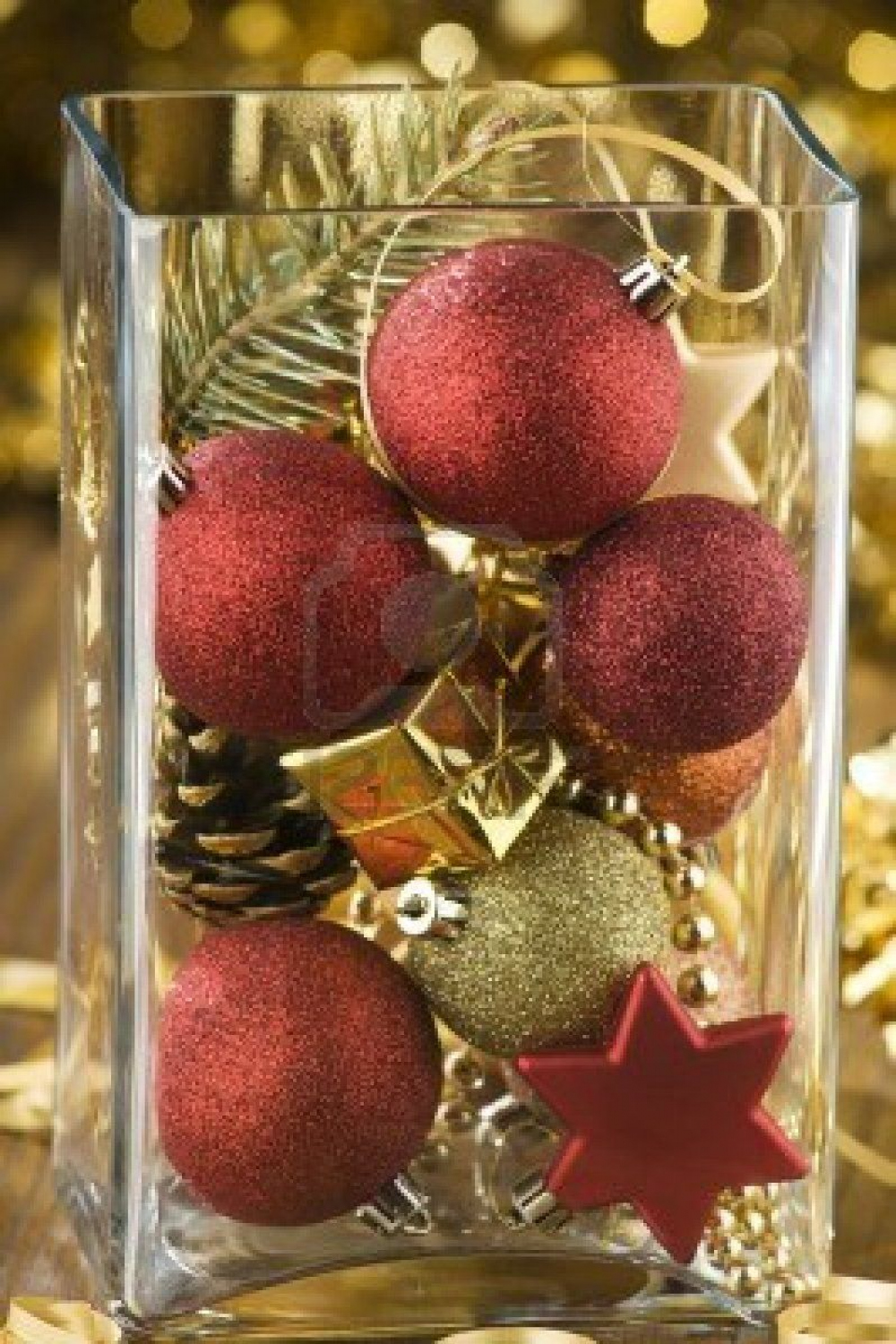 mixed christmas ornaments in big glass vase close up  Christmas